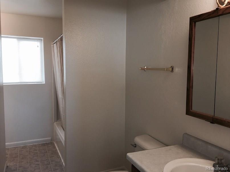 2153 Preuss Road Colorado Springs, CO 80910 - Photo 12 of 17 a bathroom with a sink and toilet