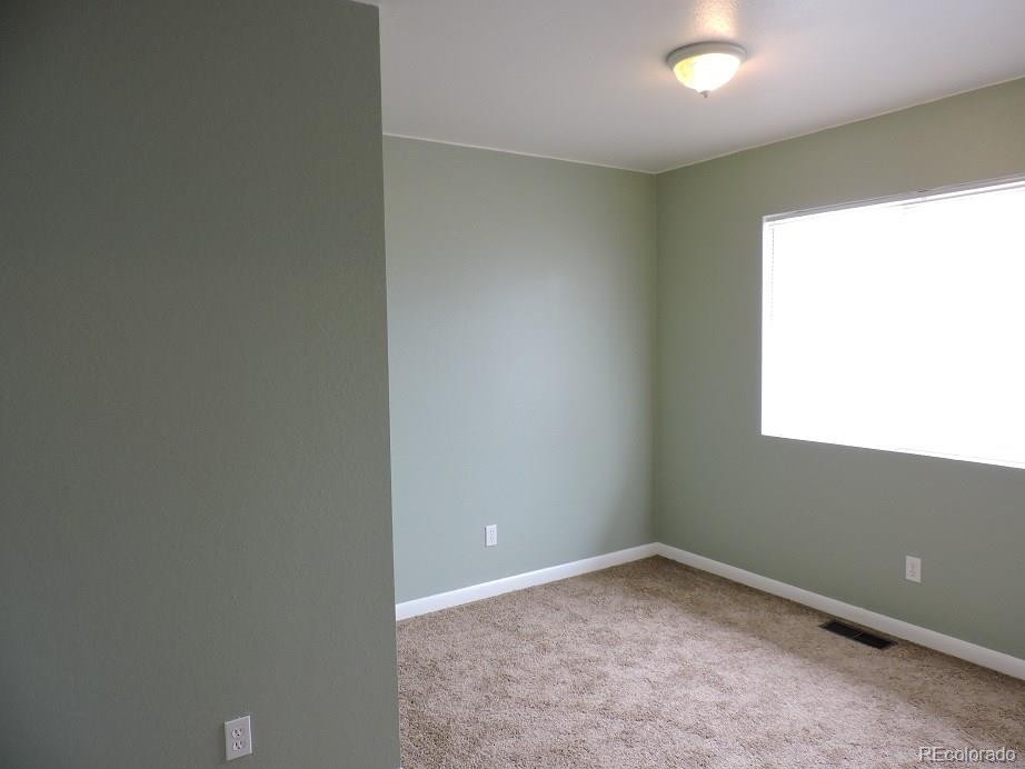 2153 Preuss Road Colorado Springs, CO 80910 - Photo 10 of 17 an empty room with a window