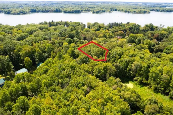 a view of a lake with houses in the back