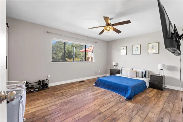 a bedroom with furniture and a window