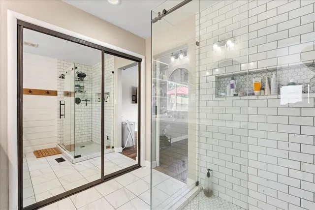 a bathroom with a glass shower door