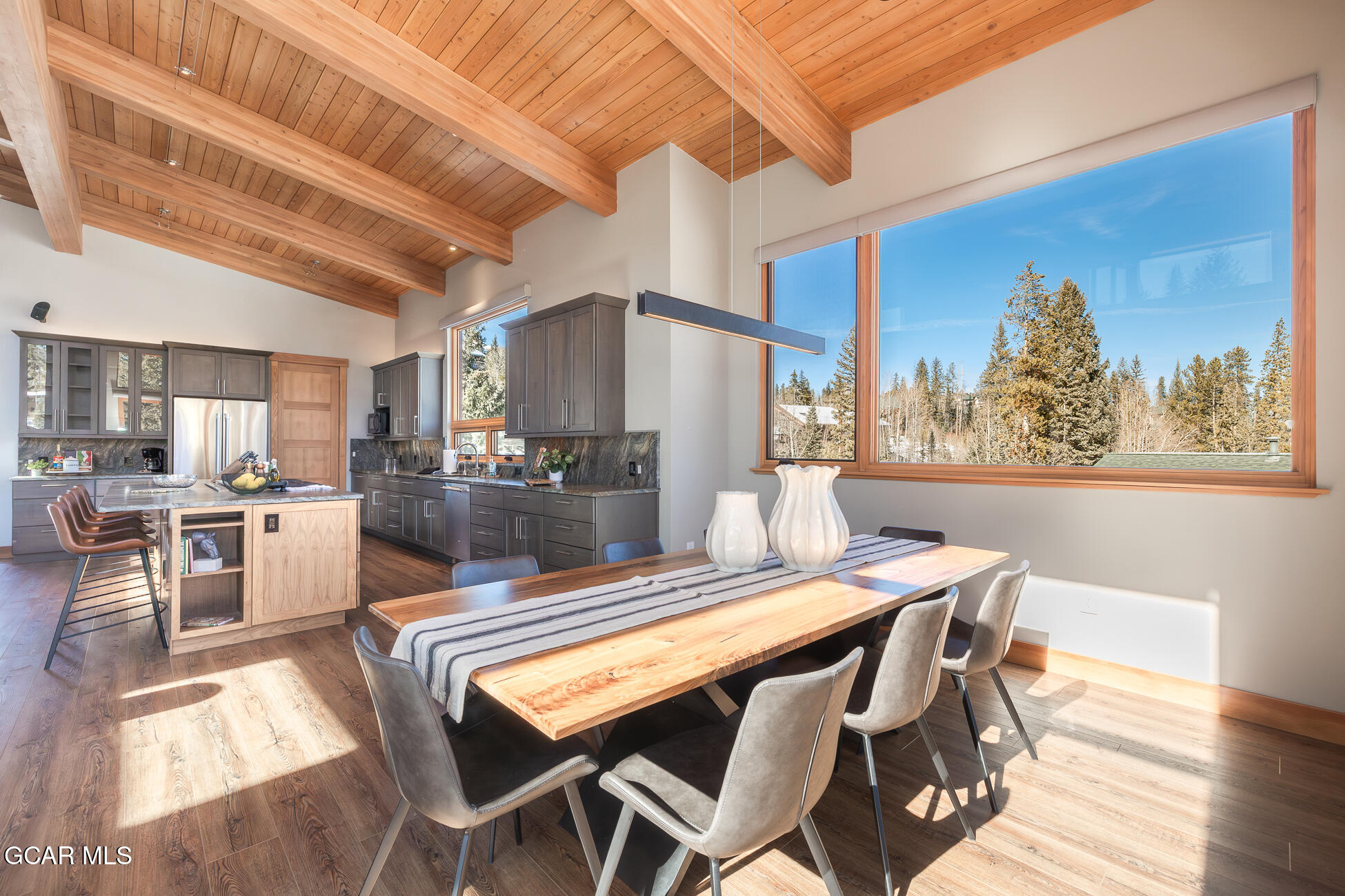 684 Vasquez Road Winter Park, CO 80482 - Photo 17 of 45 a view of a dining room with furniture and wooden floor