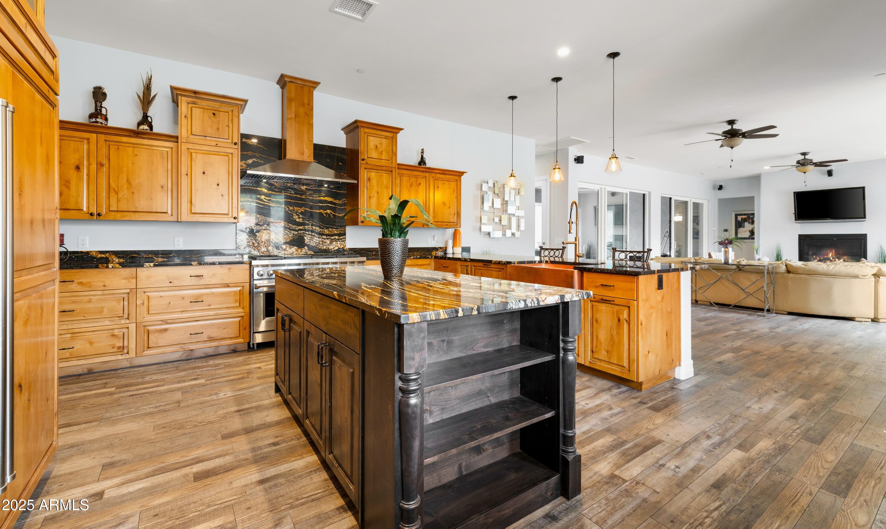 10 Ho Hum Circle Sedona, AZ 86351 - Photo 18 of 48 a kitchen with stainless steel appliances granite countertop a stove and more cabinets