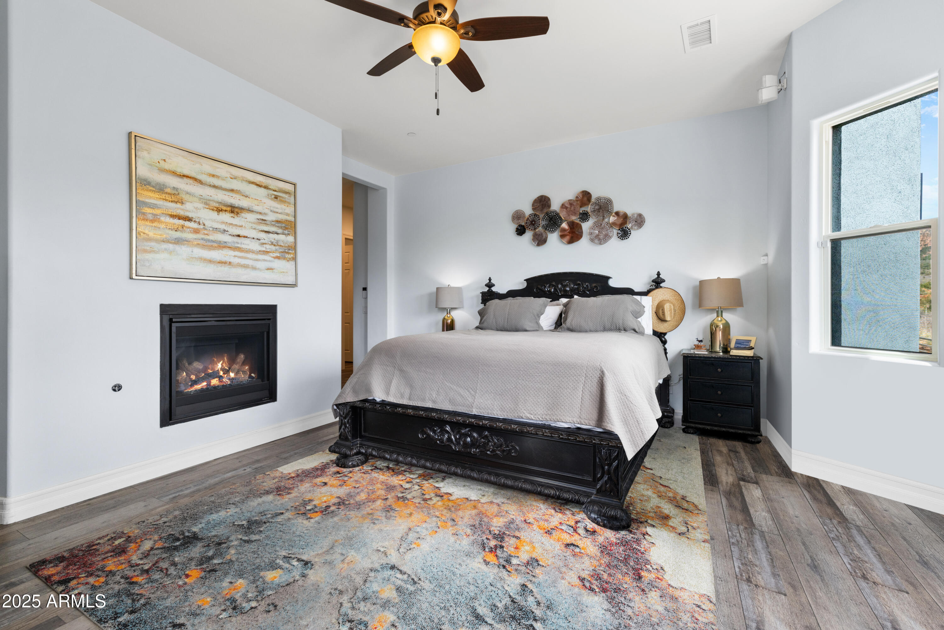 10 Ho Hum Circle Sedona, AZ 86351 - Photo 22 of 48 a bedroom with a bed and a fireplace