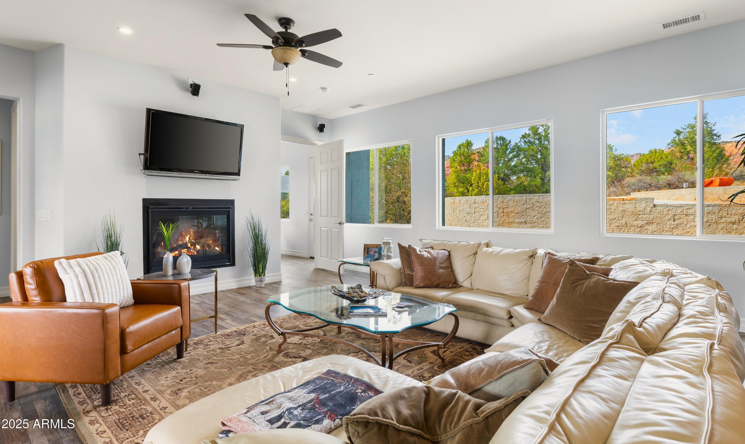 10 Ho Hum Circle Sedona, AZ 86351 - Photo 8 of 48 a living room with furniture fireplace and a flat screen tv