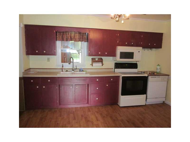 1961 Jefferson Road Rices Landing, PA 15357 - Photo 4 of 14 Kitchen. Cozy and comfortable kitchen with pretty laminate flooring