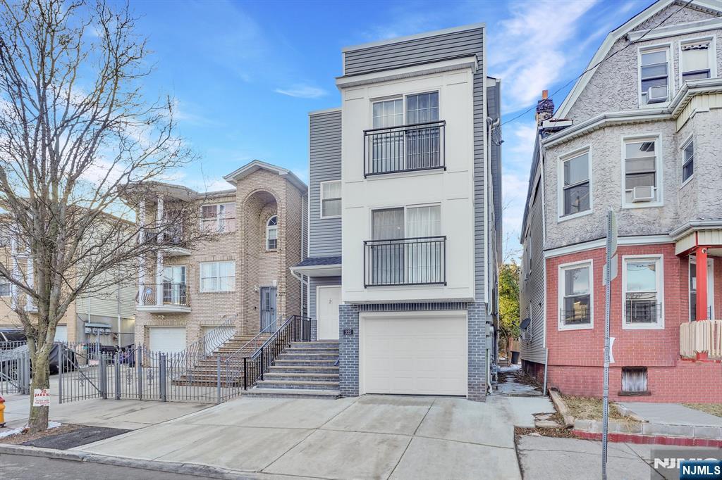 225 South 9th Street Newark, NJ 07103 - Photo 2 of 35 a front view of a building with a yard