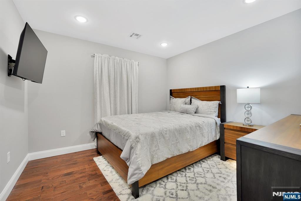 225 South 9th Street Newark, NJ 07103 - Photo 28 of 35 a bedroom with bed and window