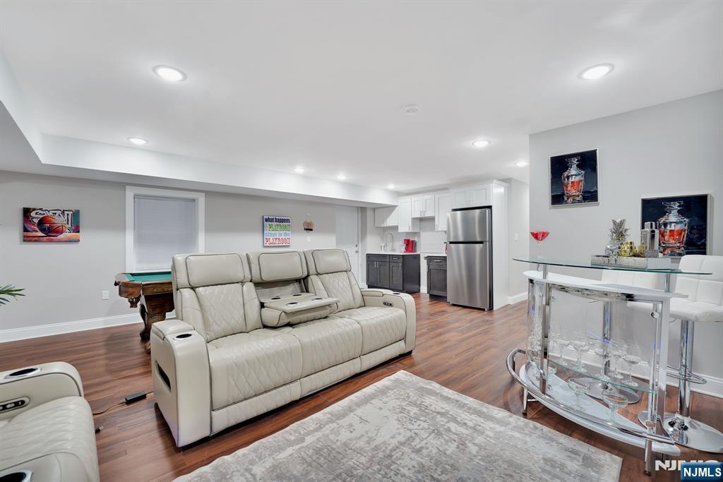 225 South 9th Street Newark, NJ 07103 - Photo 4 of 35 a living room with furniture and a flat screen tv