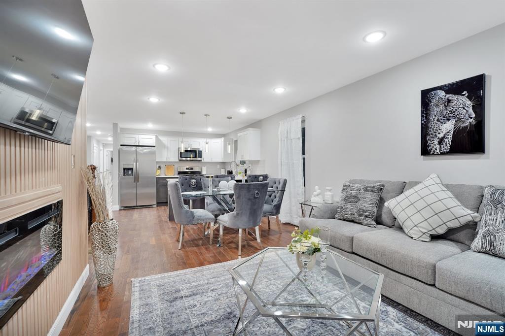 225 South 9th Street Newark, NJ 07103 - Photo 10 of 35 a living room with furniture and a fireplace