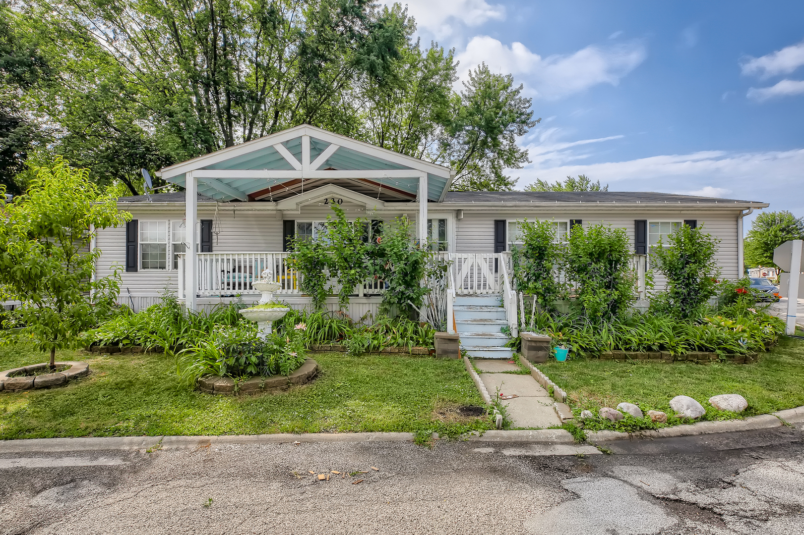 230 Whippletree Road Wheeling, IL 60090 - Photo 2 of 17 a front view of house with yard and green space