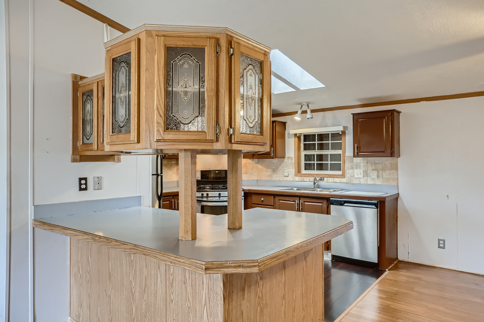 230 Whippletree Road Wheeling, IL 60090 - Photo 7 of 17 a kitchen with stainless steel appliances granite countertop a sink and a granite counter tops