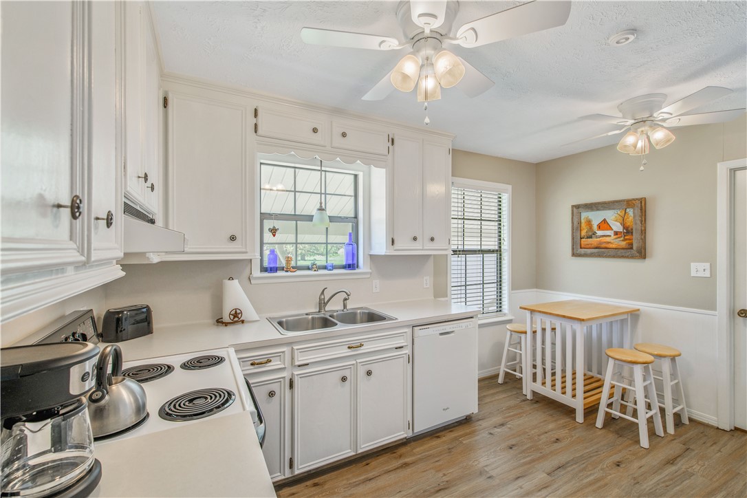 3675 Zulch Road North Zulch, TX 77872 - Photo 11 of 22 a kitchen that has a lot of cabinets in it and wooden floors