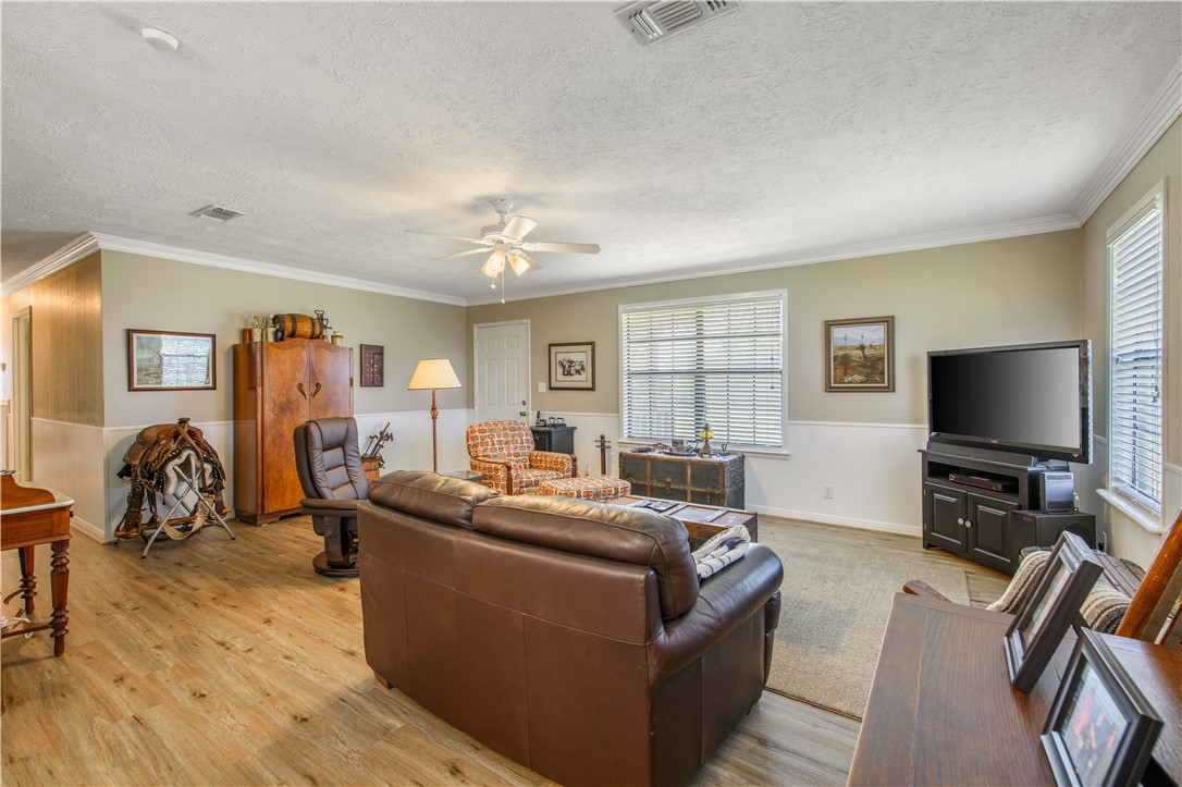 3675 Zulch Road North Zulch, TX 77872 - Photo 7 of 22 a living room with furniture and a flat screen tv