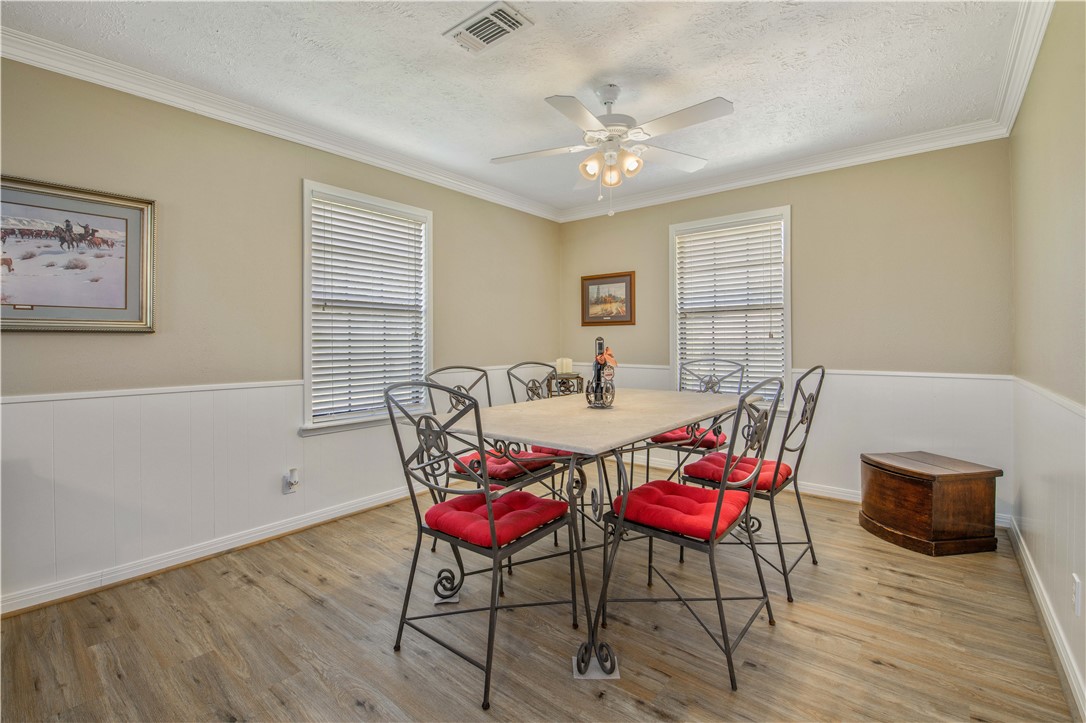 3675 Zulch Road North Zulch, TX 77872 - Photo 10 of 22 a view of a dining room with furniture and wooden floor