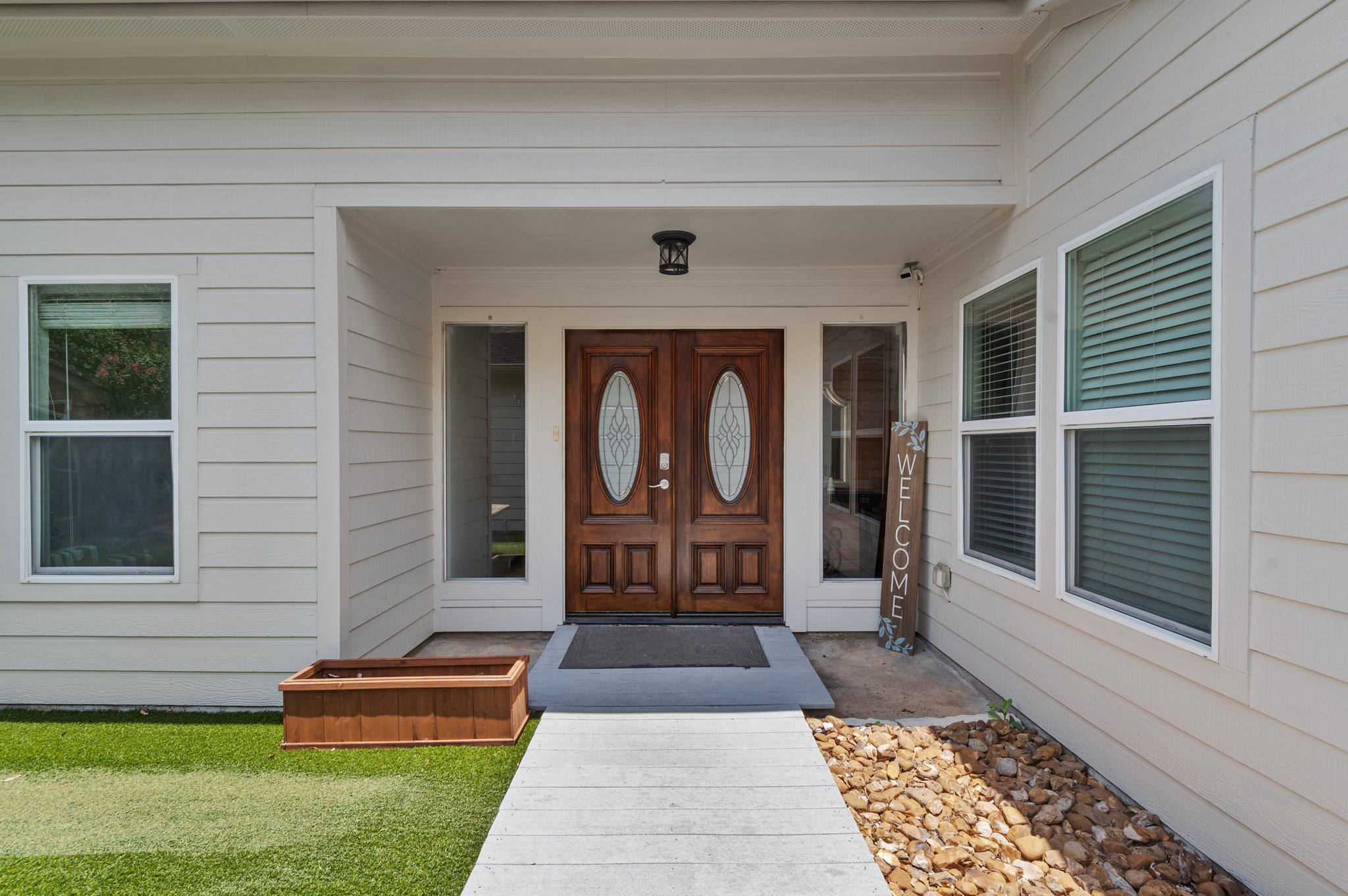 a front view of a house with garden
