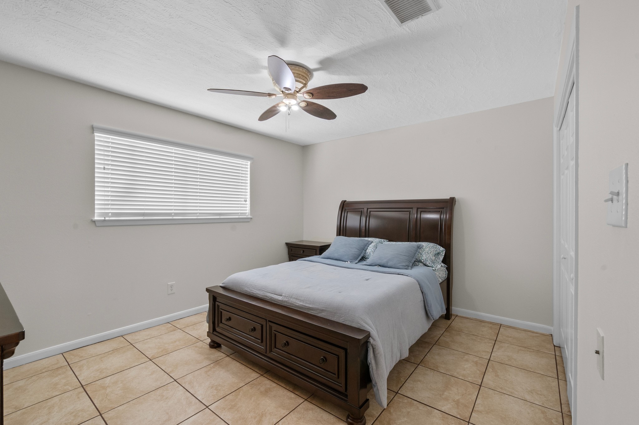 706 Geronimo Court Katy, TX 77450 - Photo 19 of 29 a bedroom with a bed and window