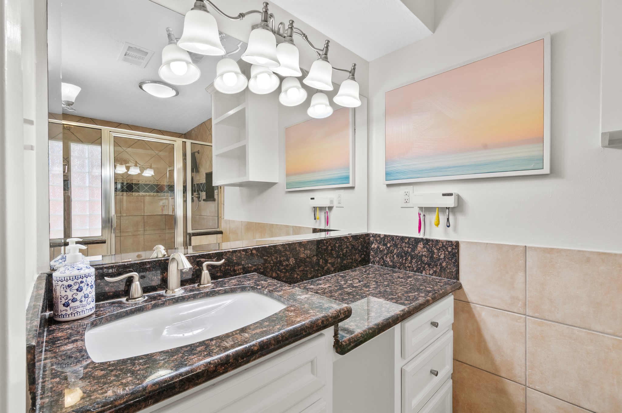 706 Geronimo Court Katy, TX 77450 - Photo 22 of 29 a bathroom with a granite countertop double vanity sink a mirror and a shower