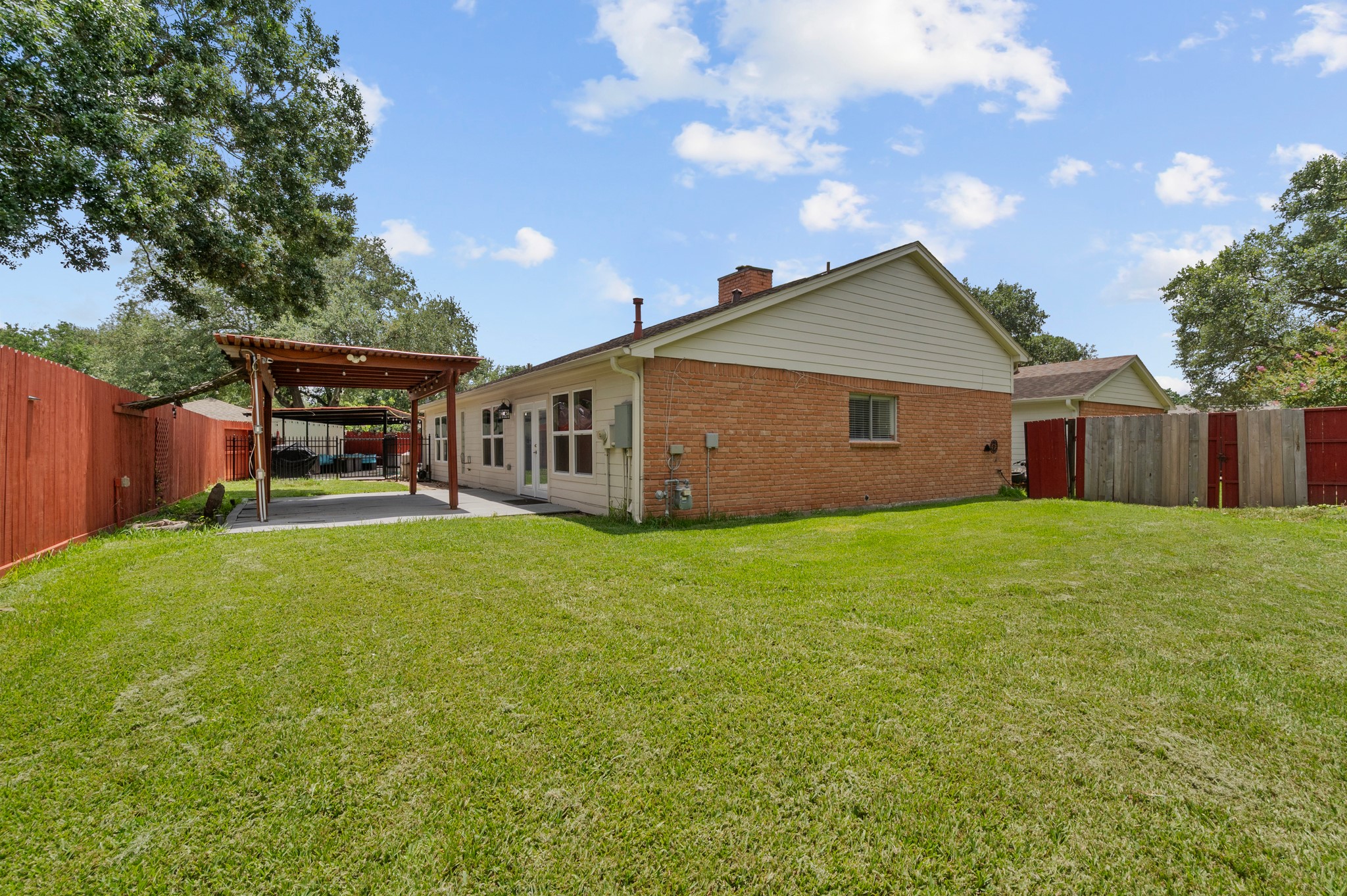706 Geronimo Court Katy, TX 77450 - Photo 27 of 29 a backyard of a house with table and chairs