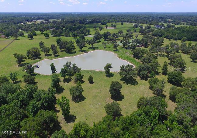 0 Northwest 95th Street Anthony, FL 32617 - Photo 9 of 14 an aerial view of a house with a lake view