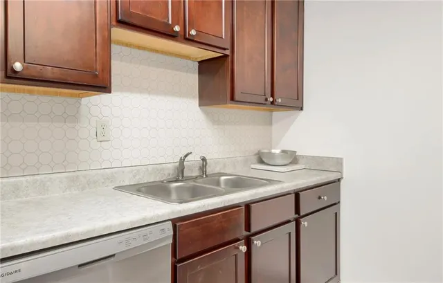 a view of a room with wooden floor and a chair