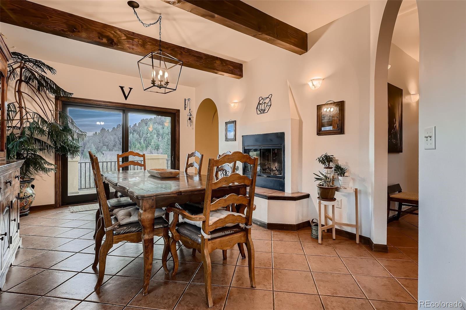 2169 Dory Hill Road Black Hawk, CO 80422 - Photo 12 of 46 a view of a dining room with furniture and chandelier