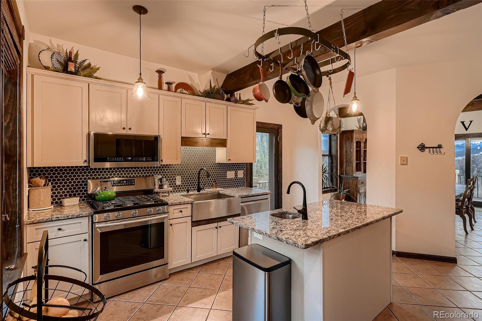 2169 Dory Hill Road Black Hawk, CO 80422 - Photo 13 of 46 a kitchen with stainless steel appliances granite countertop a sink a stove and a refrigerator
