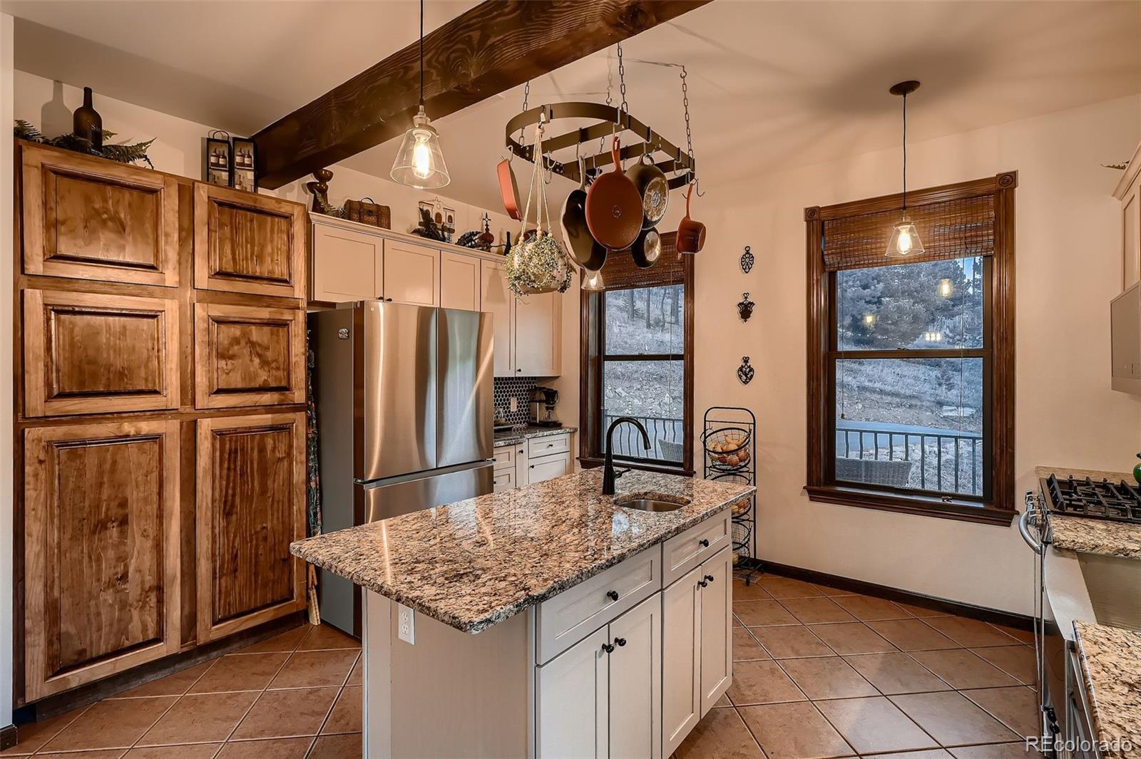 2169 Dory Hill Road Black Hawk, CO 80422 - Photo 14 of 46 a kitchen with stainless steel appliances granite countertop a sink refrigerator and cabinets