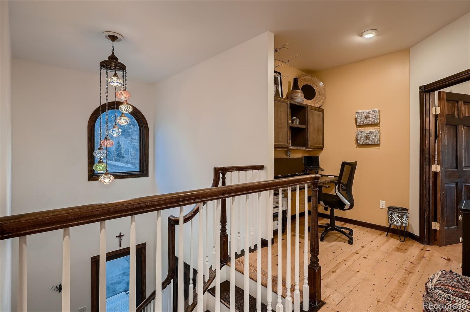 2169 Dory Hill Road Black Hawk, CO 80422 - Photo 15 of 46 a view of a hallway with workspace