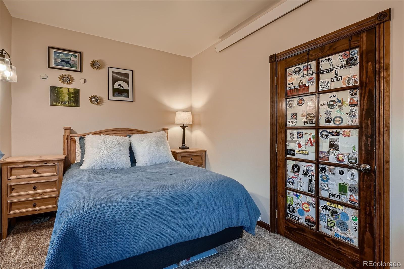 2169 Dory Hill Road Black Hawk, CO 80422 - Photo 20 of 46 a large bed sitting in a bedroom next to a window