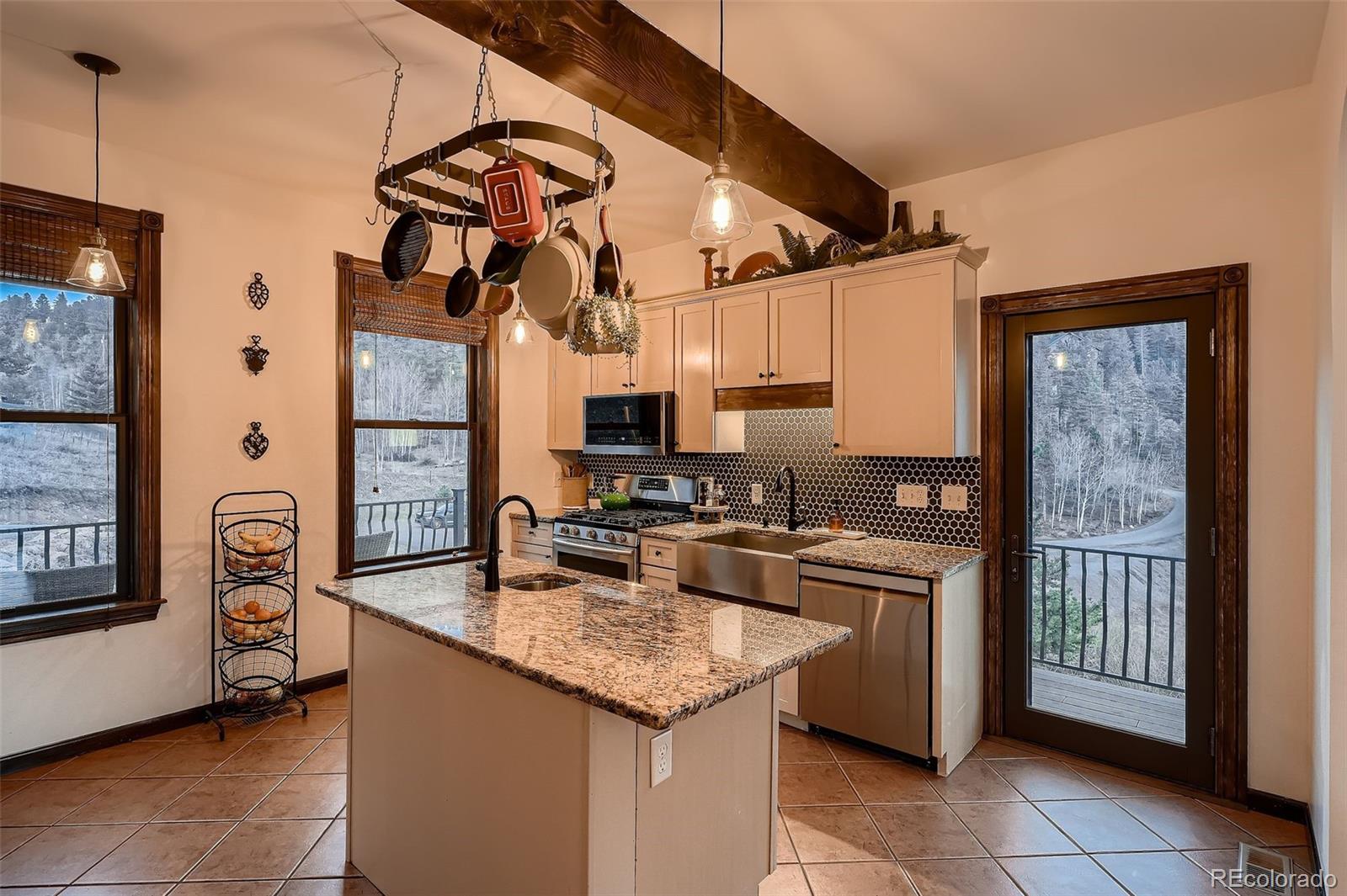 2169 Dory Hill Road Black Hawk, CO 80422 - Photo 2 of 46 a kitchen with stainless steel appliances granite countertop a stove and a refrigerator