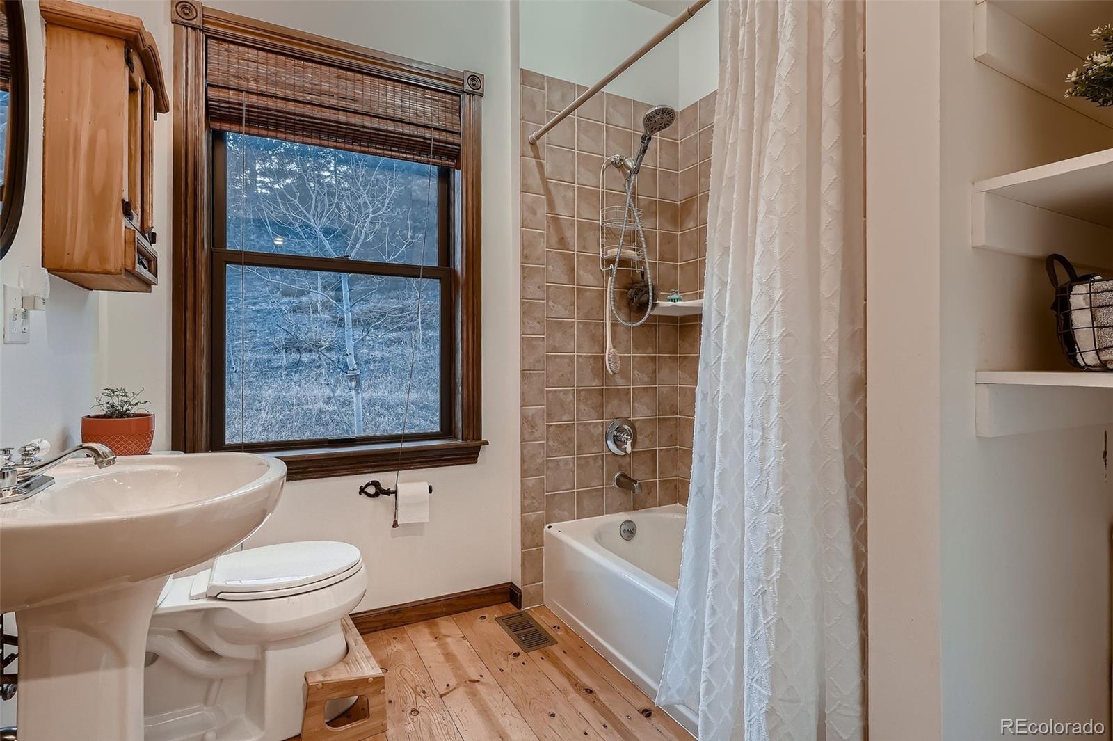 2169 Dory Hill Road Black Hawk, CO 80422 - Photo 22 of 46 a bathroom with a sink toilet and shower