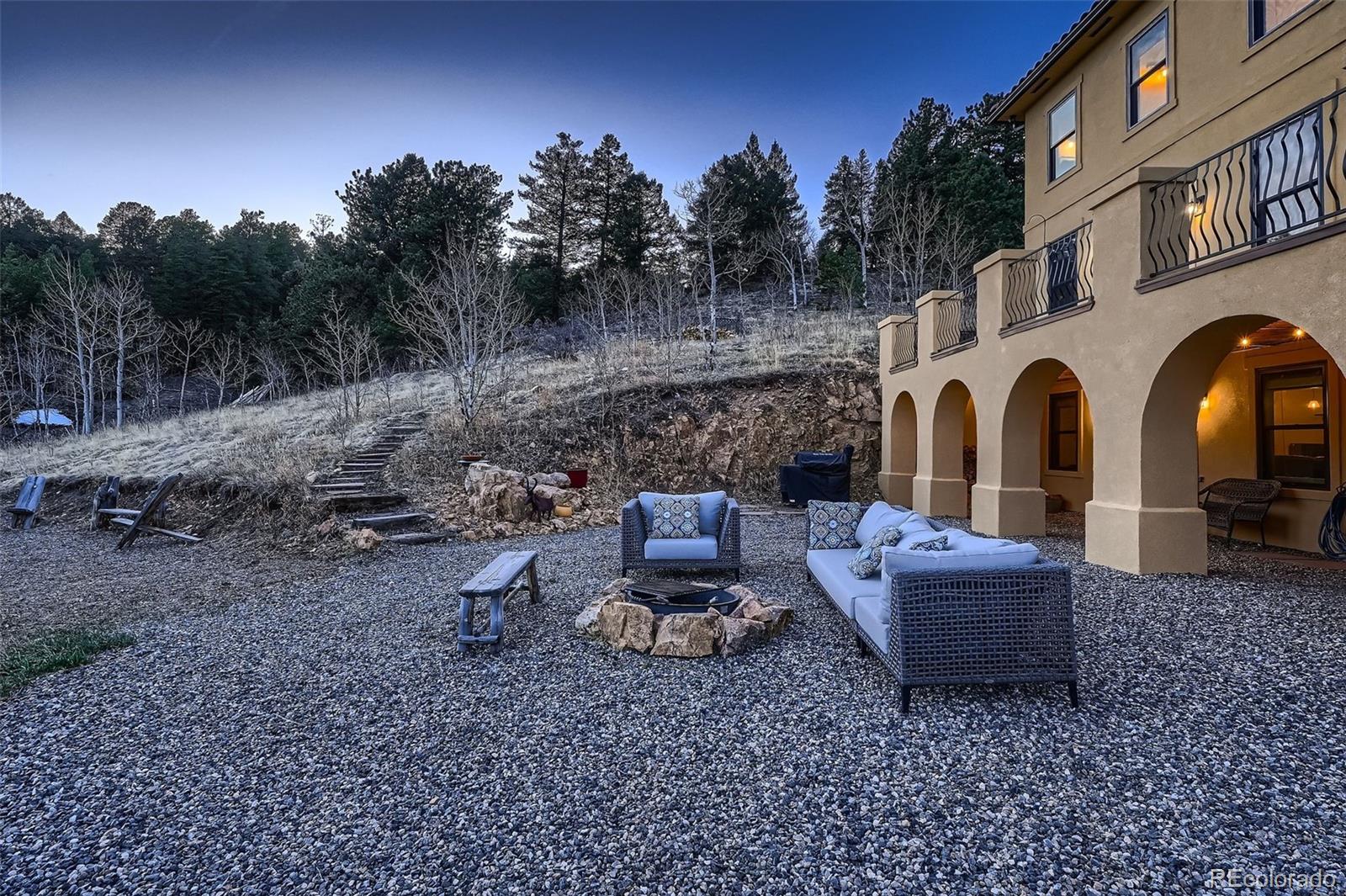 2169 Dory Hill Road Black Hawk, CO 80422 - Photo 30 of 46 a view of a couches and a fire pit in the yard