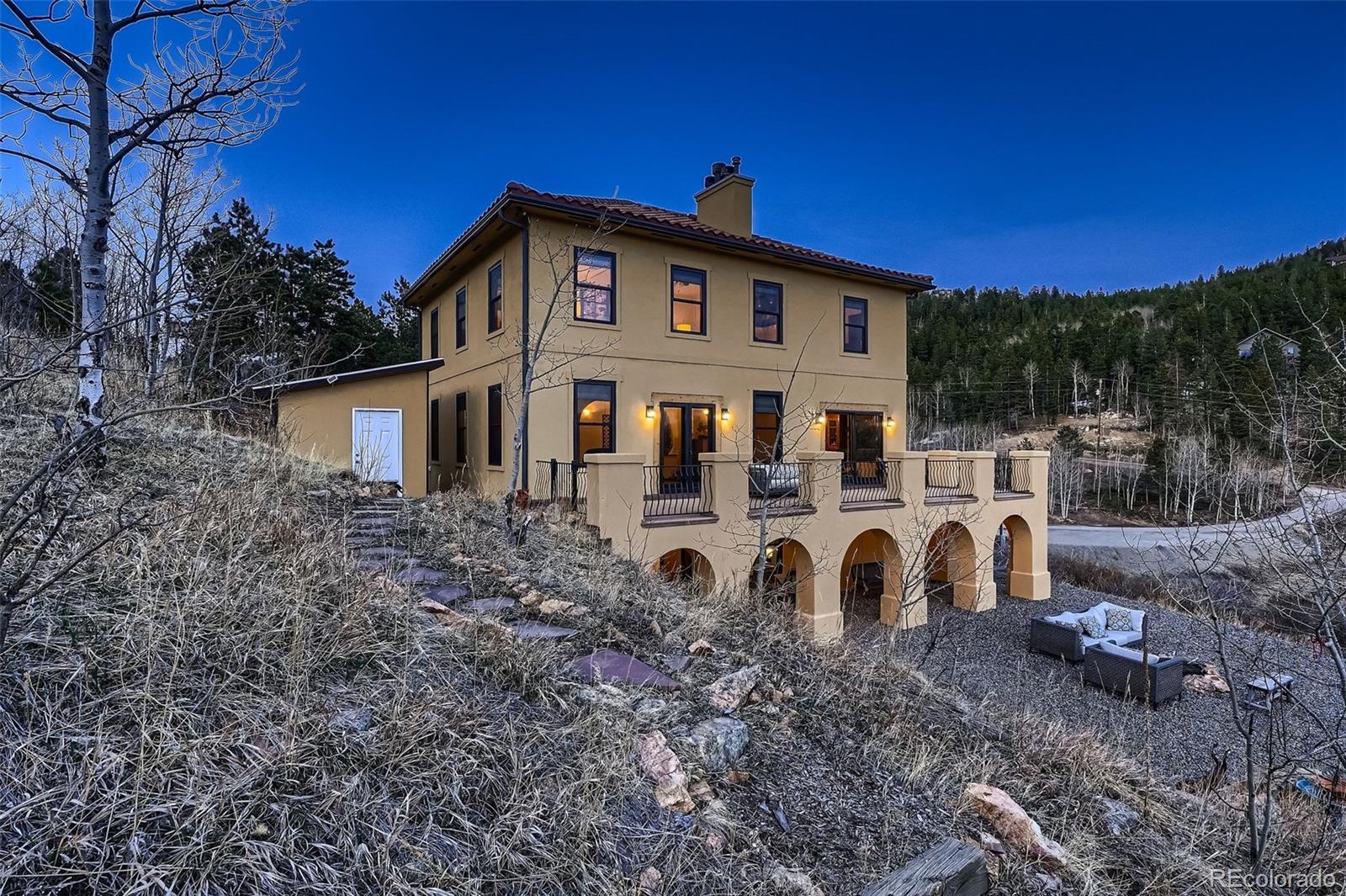 2169 Dory Hill Road Black Hawk, CO 80422 - Photo 34 of 46 a view of a house with backyard and trees