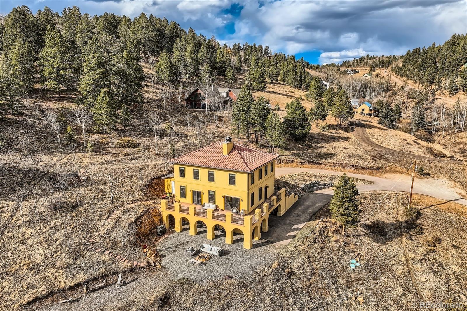 2169 Dory Hill Road Black Hawk, CO 80422 - Photo 37 of 46 a view of a large building with a yard
