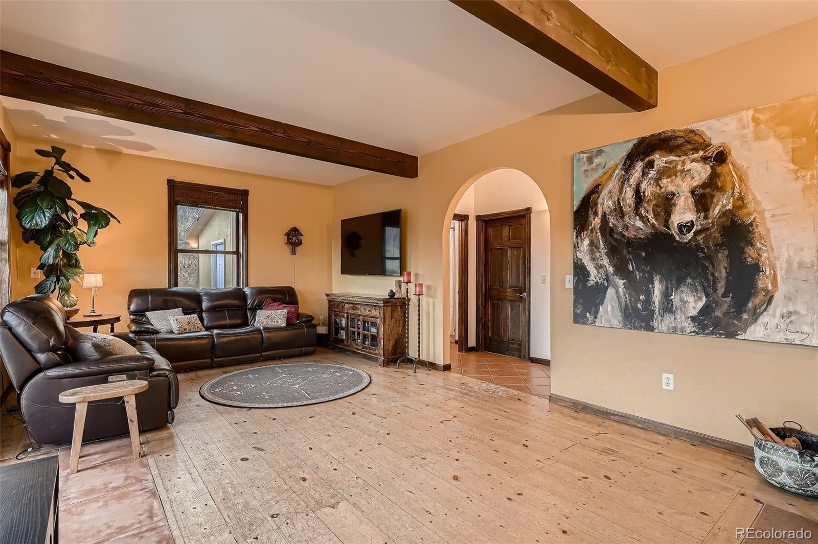 2169 Dory Hill Road Black Hawk, CO 80422 - Photo 4 of 46 a living room with furniture and a fireplace