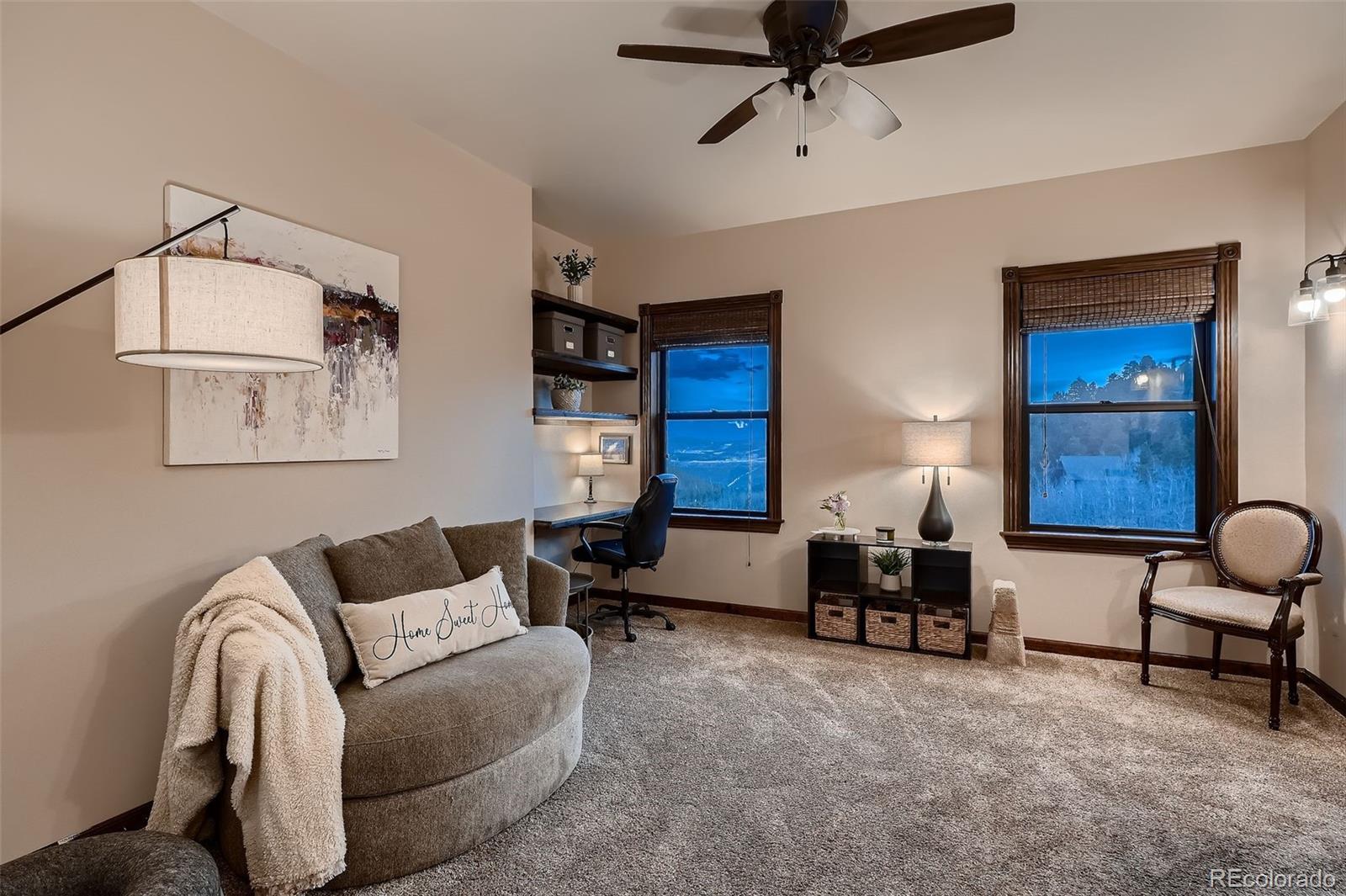2169 Dory Hill Road Black Hawk, CO 80422 - Photo 7 of 46 a living room with furniture and a lamp