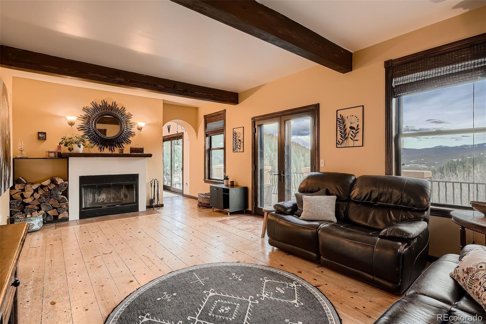 2169 Dory Hill Road Black Hawk, CO 80422 - Photo 10 of 46 a living room with furniture and a fireplace