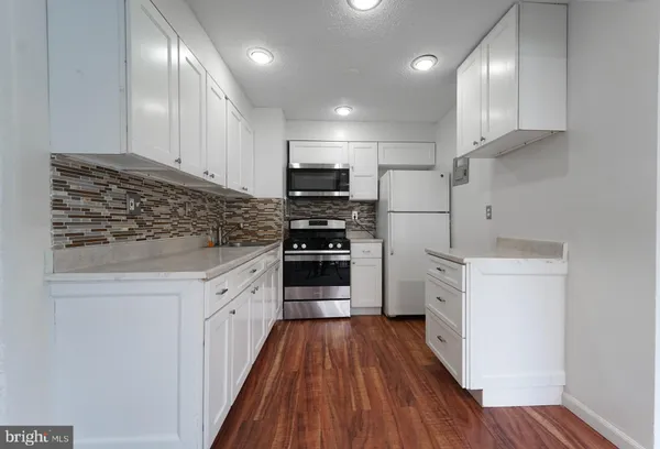 a view of an empty room with a sliding door