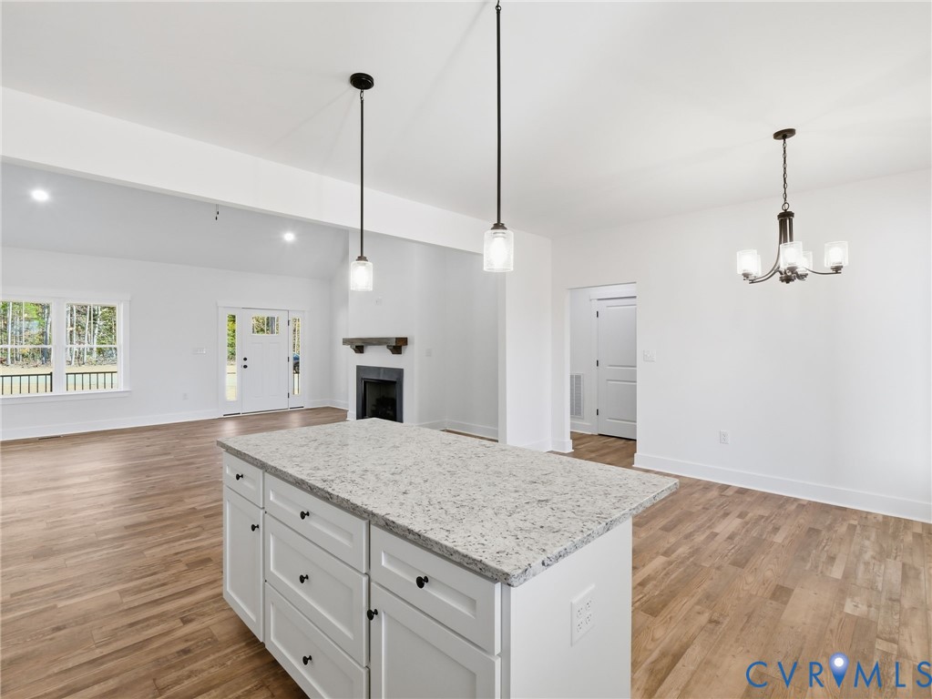 3706 Broad St Road Gum Spring, VA 23065 - Photo 7 of 34 a kitchen with kitchen island a sink stainless steel appliances and living room view