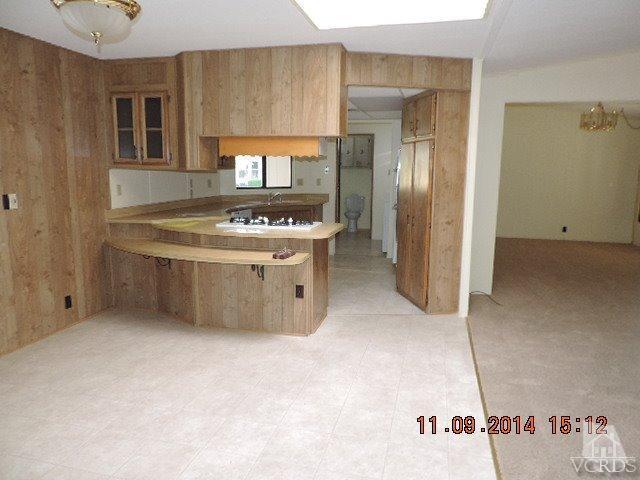 975 West Telegraph Road, Unit 85 Santa Paula, CA 93060 - Photo 3 of 19 a kitchen with stainless steel appliances a stove a refrigerator and a cabinets
