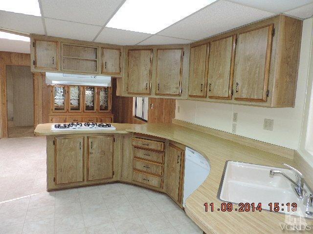 975 West Telegraph Road, Unit 85 Santa Paula, CA 93060 - Photo 8 of 19 a bathroom with a sink a washer and dryer