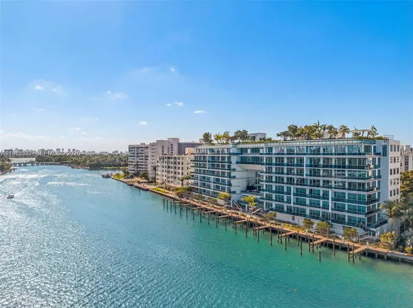 a view of a lake with building in front of it