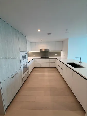 a bathroom with a sink toilet and mirror