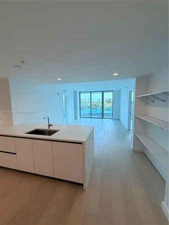 a bathroom with a double vanity sink and mirror