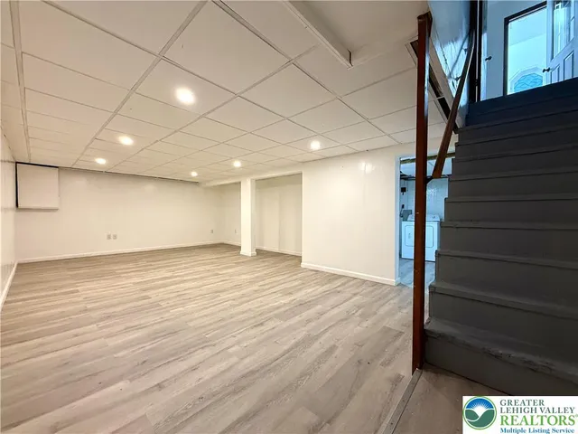 a view of an empty room with stairs and ventilation