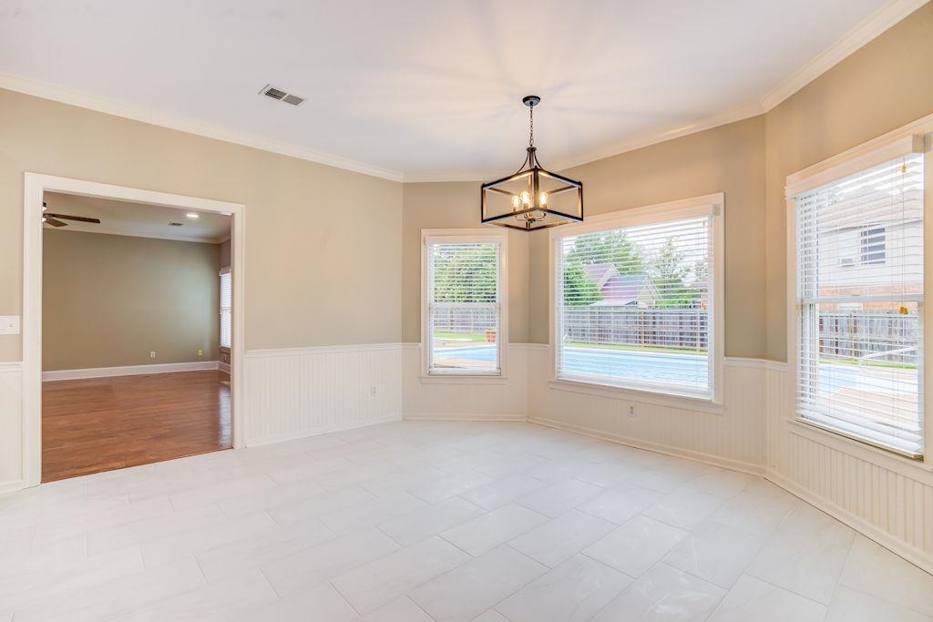 1633 Beckenhall Street Collierville, TN 38017 - Photo 14 of 35 a view of an empty room with window and cabinet area