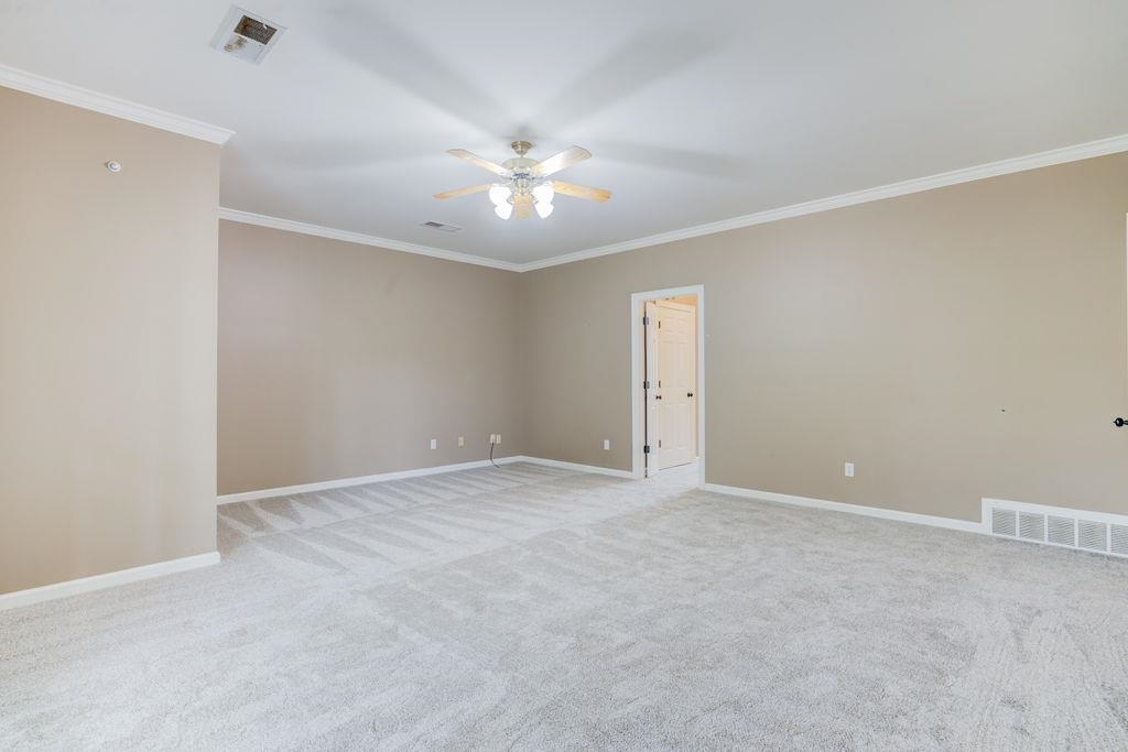 1633 Beckenhall Street Collierville, TN 38017 - Photo 17 of 35 a view of an empty room with a ceiling fan