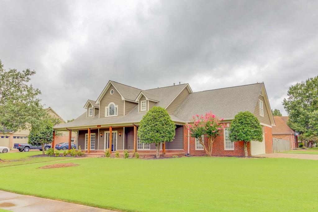 1633 Beckenhall Street Collierville, TN 38017 - Photo 2 of 35 front view of a house with a yard and a trees