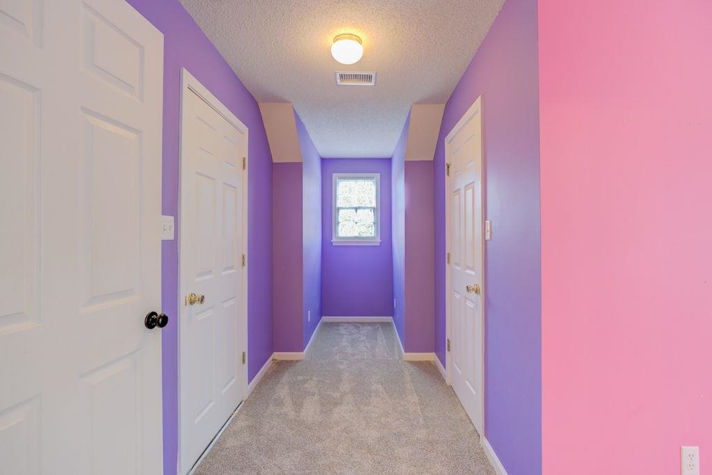 1633 Beckenhall Street Collierville, TN 38017 - Photo 26 of 35 a view of a hallway with wooden floor and windows
